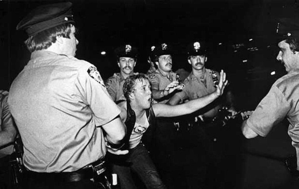 NYPD officers detain a patron outside the Stonewall Inn during the June 1969 police raid