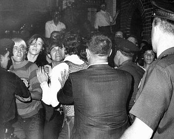 Police confront a crowd outside the Stonewall Inn during the 1969 raid